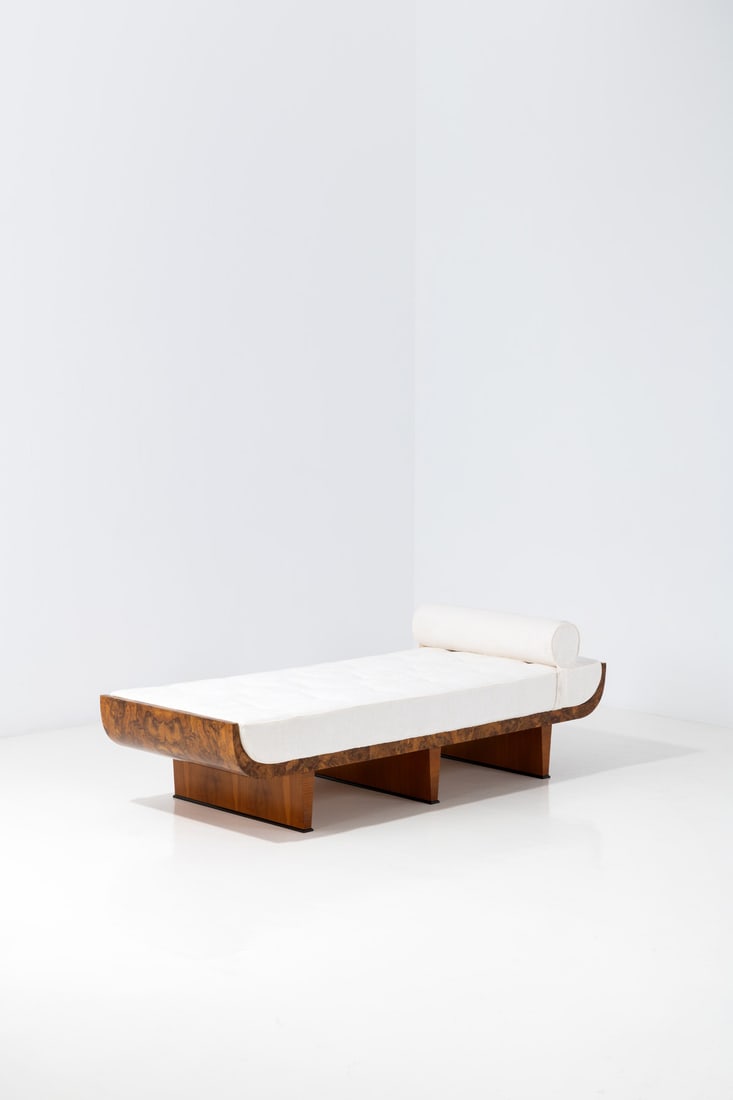 Gio Ponti (1891-1979) & Emilio Lancia (1890-1973): Gio Ponti (1891-1979)& Emilio Lancia (1890-1973)DaybedWalnut burl veneer, walnut, painted wood and fabricModel created circa 1927H 58 × L 183,5 × W 68,5 × PcmExpertise conducted by the
