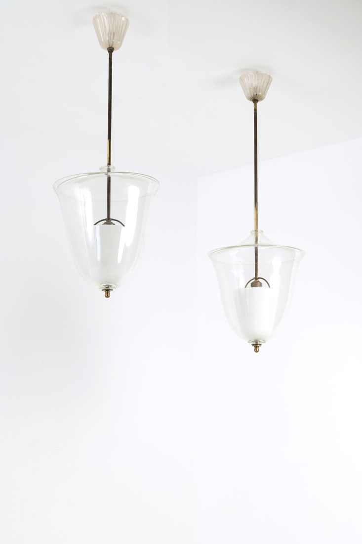 Archimede Seguso (1909-1999) Pair of suspensions: Archimede Seguso (1909-1999)Pair of suspensionsBrass, metal, opaline glass and glassEdited by Seguso Vetri d'ArteModel created circa 1950H 75 × Ø 32 cm