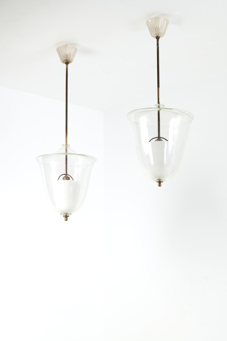 xx Archimede Seguso (1909-1999) Set of two suspensions: xx Archimede Seguso (1909-1999)Set of two suspensionsBrass, metal, opaline glass and glassEdited by Seguso Vetri d'ArteModel created circa 1950H 80 × Ø 32cmH 94 × Ø 32cm