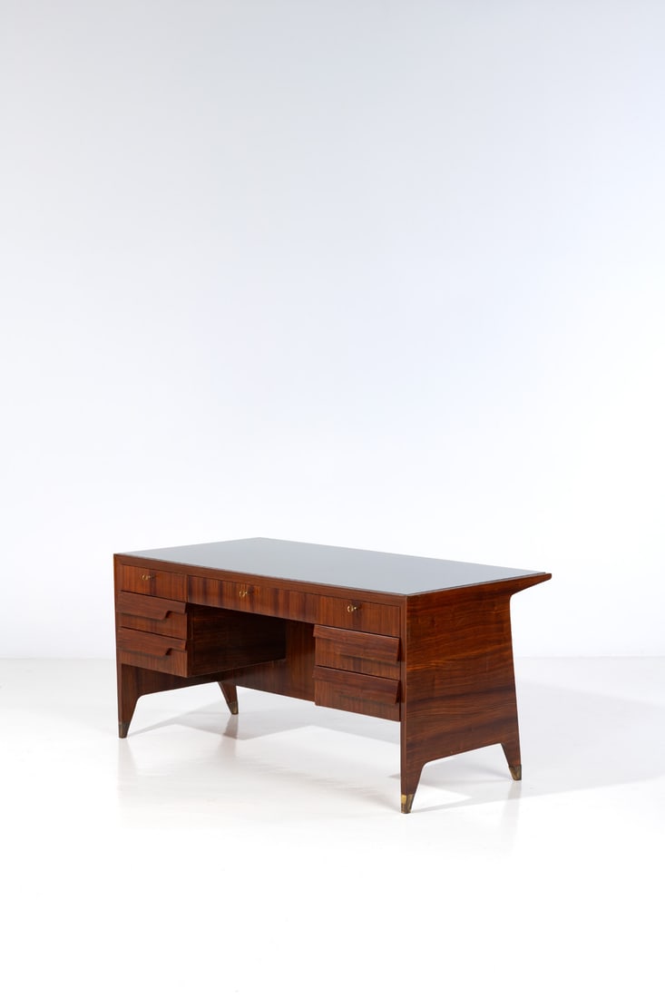 Gio Ponti (1891-1979) Desk: Gio Ponti (1891-1979)DeskWood, brass and eglomized glassModel created circa 1950H 77 × L 161 × W 85 cmNote : This model was created for the Vembi-Burroughs offices.Bibliography: U. La