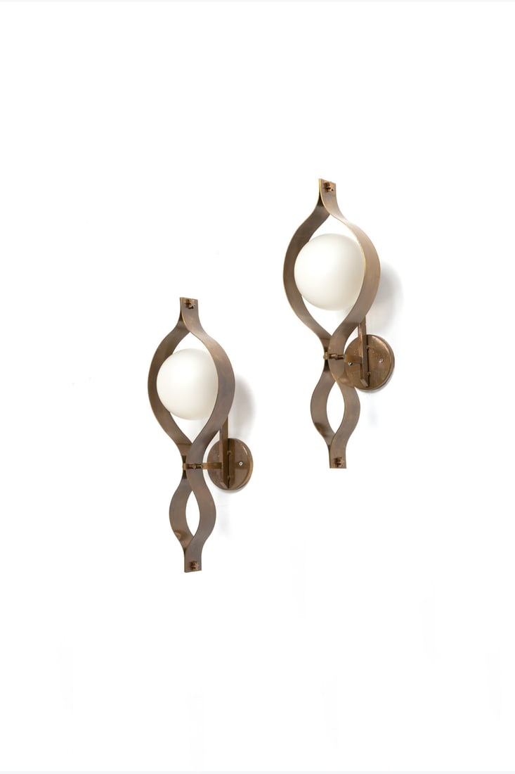 Gio Ponti (1891-1979) Pair of sconces - 'Pavone' model: Gio Ponti (1891-1979)Pair of sconces - 'Pavone' modelBrass and opaque glassEdited by ArredoluceModel created circa 1965H 58 × L 19 × W 22 cmExpertise conducted by the Gio Ponti Archives.