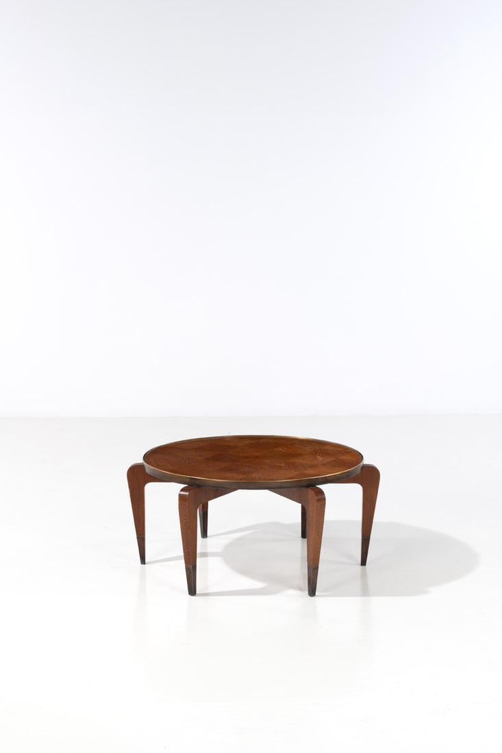Gio Ponti (1891-1979) Coffee table: Gio Ponti (1891-1979)Coffee tableOak and brassModel created circa 1930H 44 × Ø 99 cmExpertise conducted by the Gio Ponti Archives.