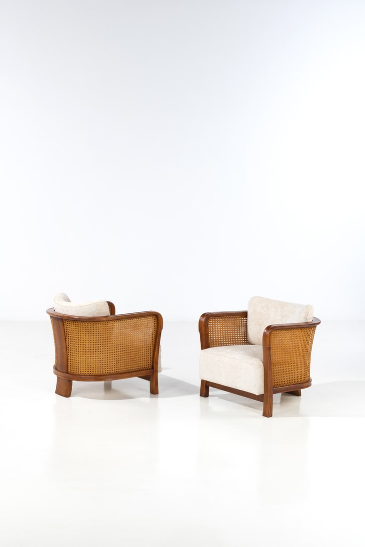Gio Ponti (1891-1979) Pair of armchairs: Gio Ponti (1891-1979)Pair of armchairsWalnut, caning and fabricEdited by Casa e GiardinoModel created in the late 1930sH 69 × L 68 × W 68 cmBibliography: Domus no. 118, October 1937,