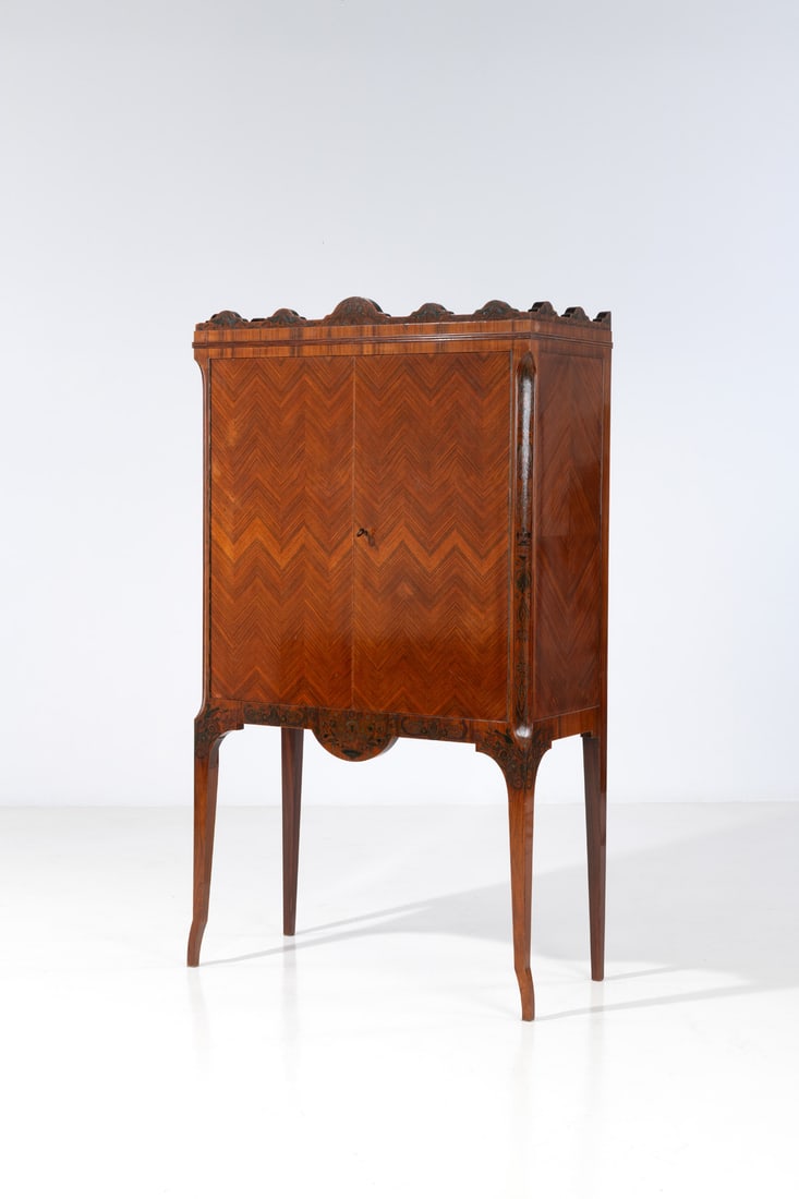 Giambattista Gianotti (1873-1928) Cabinet: Giambattista Gianotti (1873-1928)CabinetVeneer and polychrome woodModel created in 1925H 180 × L 102 × W 47 cmProvenance: Model created and exhibited at theOfficine Riunite d'Arte