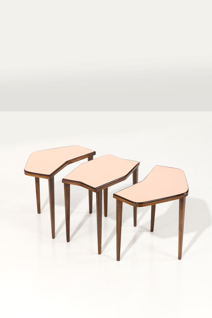 Gio Ponti (1891-1979) Set of three side tables: Gio Ponti (1891-1979)Set of three side tablesStained walnut and mirrored stained glassEdited by Fontana ArteModel created circa 1955H 40 × L 47,5 ×W 25 cmH 40 × L 42 × W 29