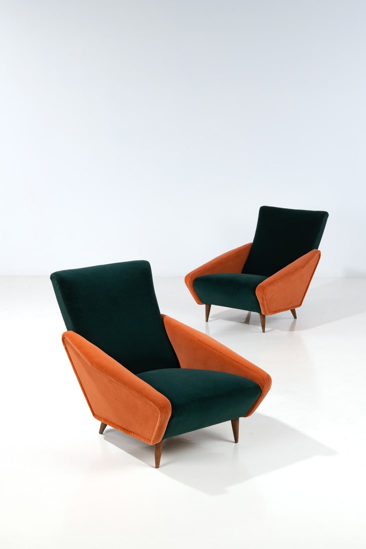 Gio Ponti (1891-1979) Pair of armchairs - Model no. 807, 'Distex': Gio Ponti (1891-1979)Pair of armchairs - Model no. 807, 'Distex'Walnut and fabricEdited by CassinaModel created circa 1953H 84 × L 80 × W 96 cmNote : Model presented in the Xth Milan