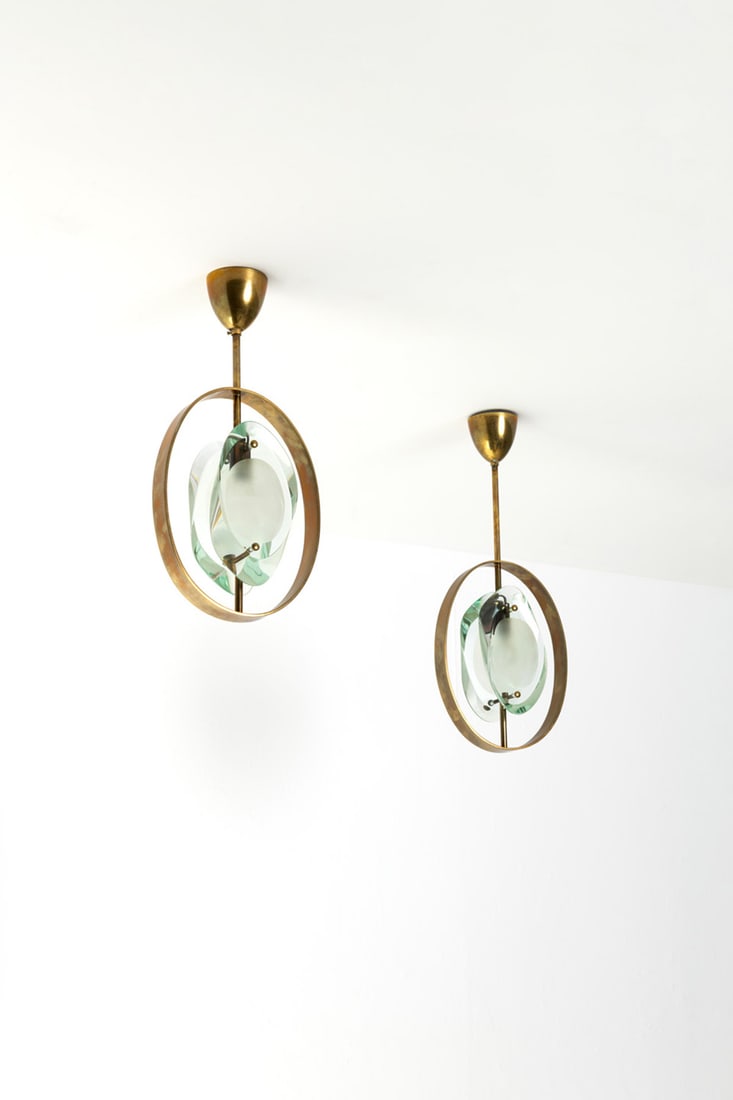 Max Ingrand (1908-1969) Pair of suspensions - Model no. 1933, 'Micro': Max Ingrand (1908-1969)Pair of suspensions - Model no. 1933, 'Micro'Brass and glassEdited by Fontana ArteModel created circa 1961H 46 × L 22,5 × W 8,5 cmH 54 × L 22 × W 8,5