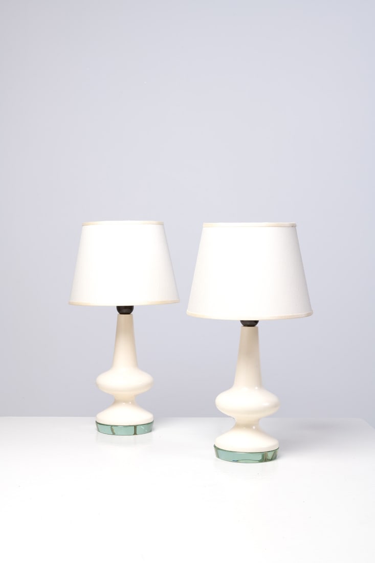 Pietro Chiesa (1879-1959) Pair of lamps: Pietro Chiesa (1879-1959)Pair of lampsLacquered wood and glassEdited by Fontana ArteManufacturer’s stampModel created in 1950H 34 × Ø 13 cmH 47,5 × Ø 25 cm (lampshade)