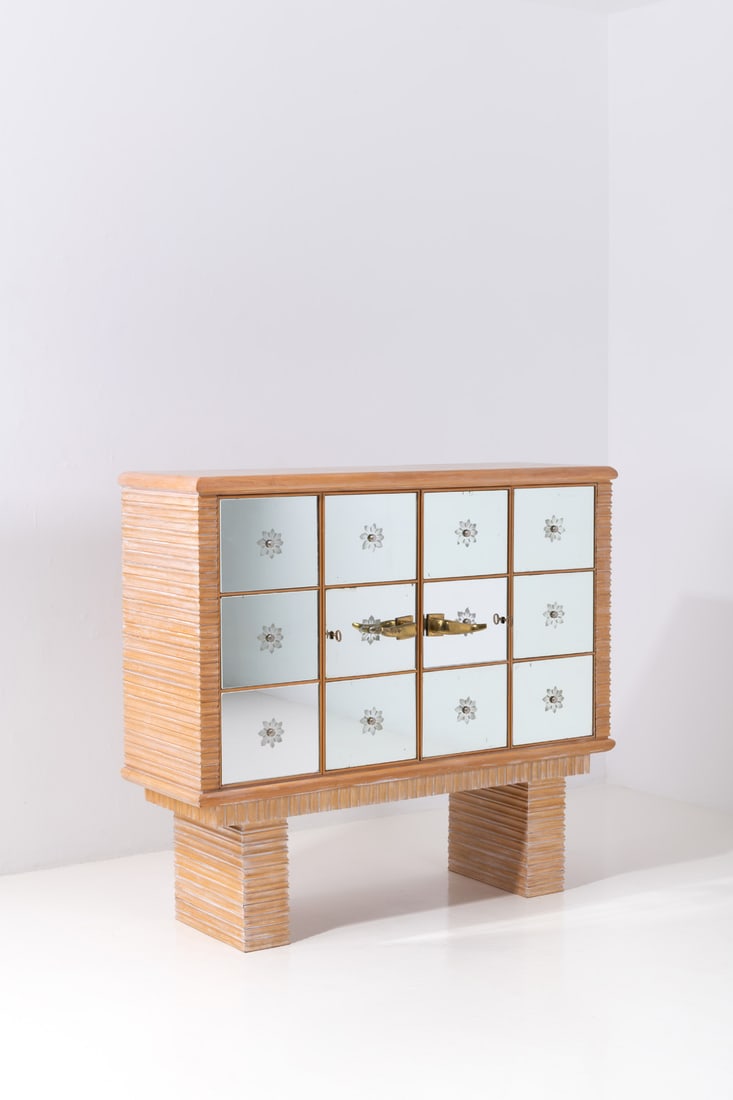 Osvaldo Borsani (1911-1985) Illuminated bar-cabinet: Osvaldo Borsani (1911-1985)Illuminated bar-cabinetWood, lacquered wood, steel, brass, and glassEdited by Arredamenti Borsani VaredoModel created in 1941H 122 × L 139 × W 42 cmBibliography:-