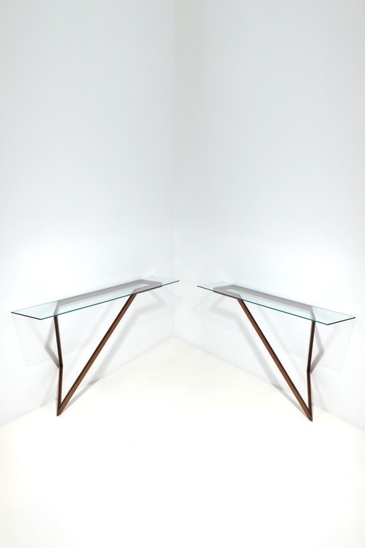 Italian production (20th c.) Pair of consoles: Italian production (20th c.)Pair of consolesWalnut and glassModel created in the 1970sH 100 × L 220 × W 38,5 cm