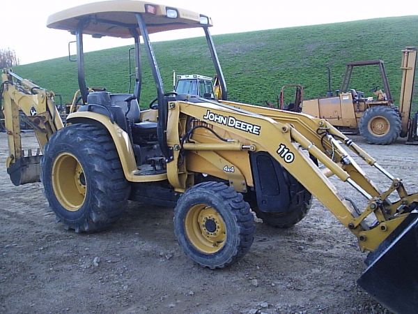 JOHN DEERE 110 4WD TRACTOR/LOADER/BACKHOE: JOHN DEERE 110 4WD TRACTOR WITH LOADER AND BACKHOE. IT HAS SKID STEER QUICK ATTACH ON THE FRONT BUCKET AND AUXILLARY REMOTES AND FRONT AND REAR. MACHINE STARTS RUNS AND OPERATES VERY WELL. SERIAL # LV
