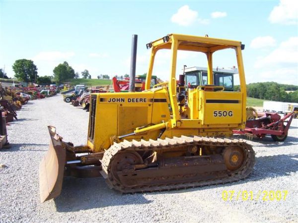 JOHN DEERE 550 G CRAWLER DOZER W/6-WAY BLD GOOD U: JOHN DEERE 550 G CRAWLER DOZER WITH 6 WAY BLADE. DIESEL, 4 SPEED POWERSHIFT, FOOT STEER. DOZER STARTS RUNS AND OPERATES WELL. VERY GOOD UNDER CARRIAGE. GOOD ORIGINAL DOZER, LOOKS TO HAVE BEEN TAKEN CA