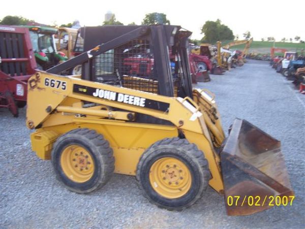 JOHN DEERE 6675 SKID STEER LOADER: JOHN DEERE 6675 SKID STEER LOADER WITH AUXILLARY REMOTES, WEIGHT KIT, QUICK ATTACH. MACHINE STARTS, RUNS AND OPERATES VERY WELL AND IS CLEAN. LOOKS TO HAVE 913 HOURS BUT THE 9 IS HARD TO MAKE OUT. SER