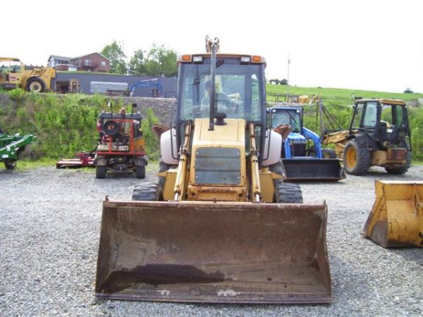 NEW HOLLAND 655 E LOADER BACKHOE 4WD/CAB/HEAT/AIR - 4
