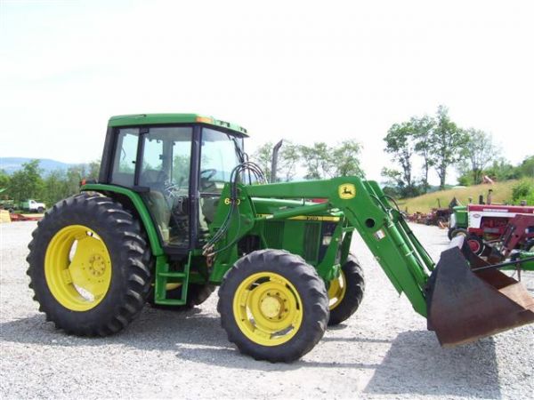 NICE JOHN DEERE 6310 4WD TRACTOR W/CAB/AIR/LDR/79: VERY NICE JOHN DEERE 6310 4WD TRACTOR WITH CAB, HEAT, AIR, POWER QUAD TRANSMISSION, DIESEL ENGINE, 3PT, 2 REMOTE OUTLETS, PTO, ORIGINAL TOPLINK, OWNERS MANUALS. JOHN DEERE 640 QUICK ATTACH LOADER WITH