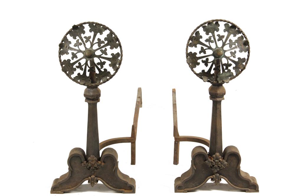 ANDIRONS: Large Arts & Crafts Period Andirons in cast iron with ornate heads of cast bronze ivy fleurette set into a twisted iron ring, on six sided baluster posts, blocked scroll feet with applied blossoms, 27
