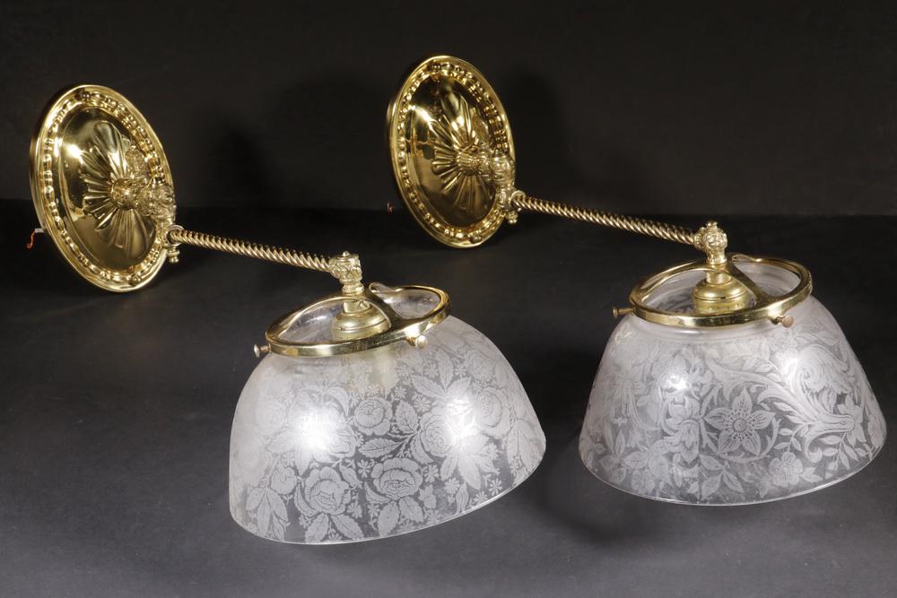 PR BRASS WALL SCONCES: Pair of Brass Twist Shaft Wall Mount Light Fixtures, single socket fixture with etched glass shades, based on a gas fixture design, each with jointed arm, 14" long (16" with shade) x 4 1/4" (7 3/8" wi