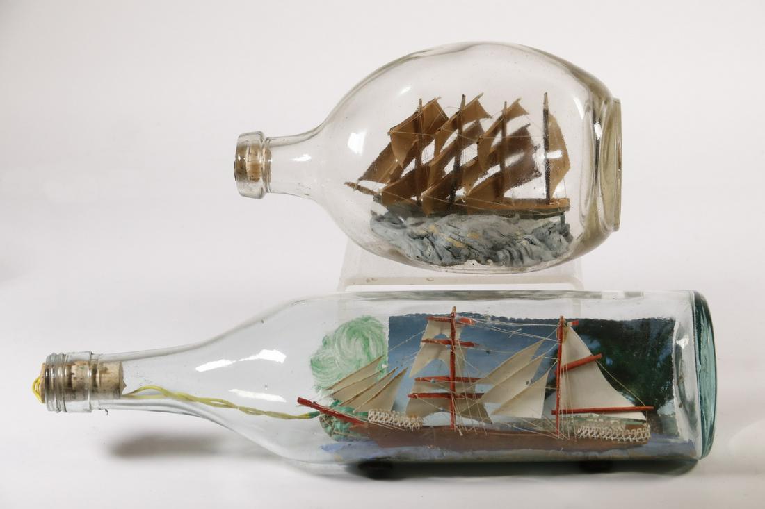 (2) SHIPS IN BOTTLES: Lot of (2) Bottles with Ship Models, incl: Pinch bottle with four mast sailing ship, 4 3/4" high, tear in back sail; and Bottle with sailing ship and inserted scene of the port of Naples, 3 1/2" high,