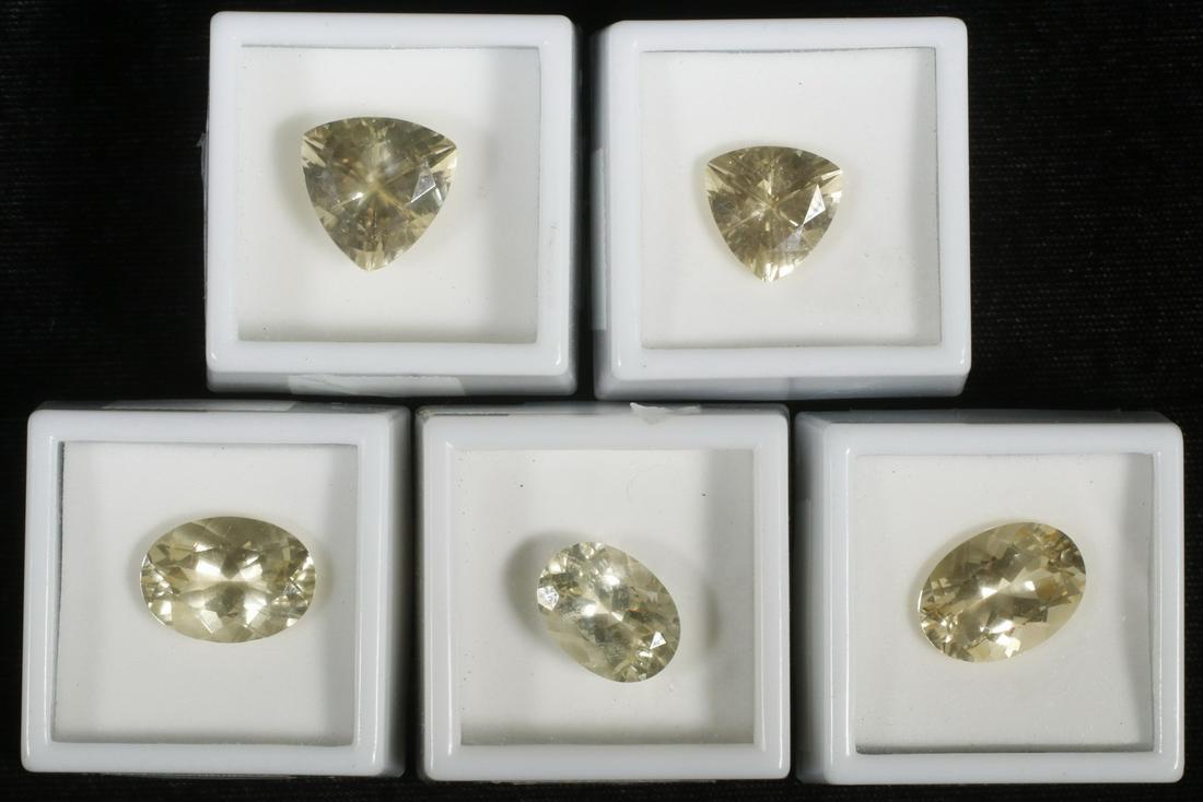 (5) LOOSE STONES: Lot includes: (1) 10.0 ct triangle shaped yellow labradorite; (1) 7.0 ct. triangle shaped yellow labradorite; (1) 9.50 ct. oval shaped yellow labradorite; (1) 9.10 ct. oval shaped yellow labradorite;