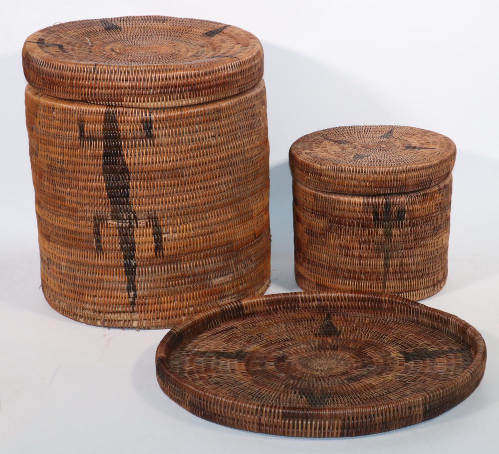 (2) RATTAN LIDDED BASKETS, PLUS TRAY: Nest of (2) Coil Woven Round Lidded Baskets, with lizard decoration, probably Indonesian, small: 9 1/4" high, 10 3/4" diam., large: 16 1/4" high, 14 1/2" diam.; PLUS Matching round tray, 18 1/4" diam.