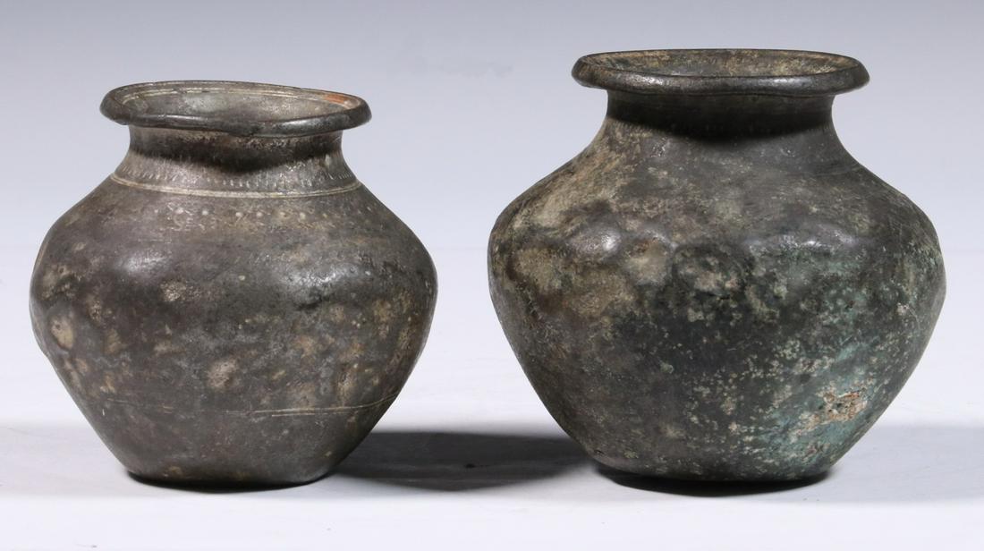 EARLY SPANISH COLONIAL TRADE BRONZES: Copper and Tin Alloy Squat Vessels, probably manufactured in South America, in traditional Incan form with rolled and scribed rims, line and dot decoration, tapered ovoid body on small foot, 3" tall. 