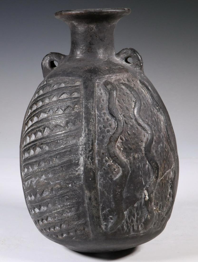 PRE-COLUMBIAN POTTERY: Chimu Inca Blackware Vessel with snake decoration, 1100-1500 AD, Peru ovoid, having a short neck with flared rim and two loop lugs for thong, 8" x 5" diam. Repairs.