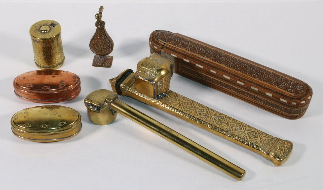 (7 PCS) MIDDLE EASTERN ACCESSORIES: Lot of (7) Middle Eastern Desk and Pocket Items, incl: (3) Pen holders, two in brass and one in inlaid wood, 8 1/4" to 9 3/4" long, losses to wooden holder, lid to one brass holder is detached; (2) Ov