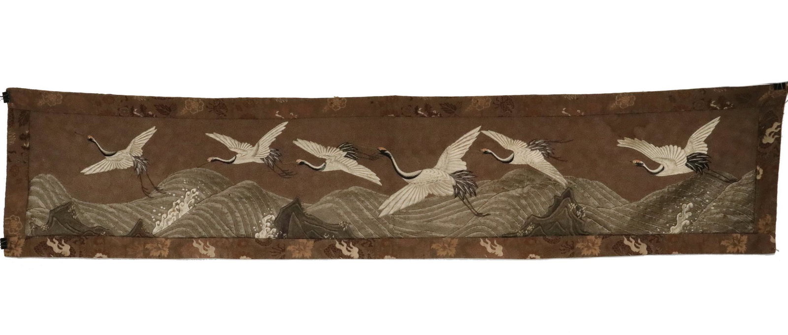 JAPANESE TAPESTRY RUNNER: 19th c. Japanese Silk Chenille Tapestry Table Runner, with flame stitched embroidery depicting six cranes flying over a stormy sea, machine woven border, chrysanthemum printed cotton backing, 19 1/2" 