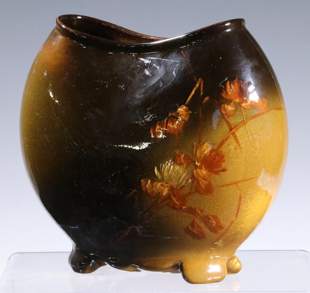 LOUWELSA WELLER ART POTTERY VASE: Circa 1900 Louwelsa Weller Pillow Form Vase, with high gloss brown and gold glazed surface and hand painted floral decoration, set on four feet, base impressed with arched "Louwelsa" half circle mark,