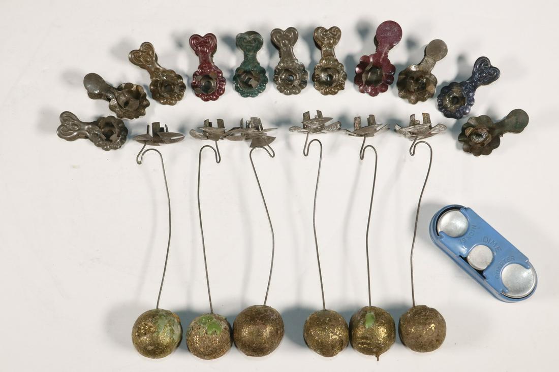 (17) VICTORIAN CHRISTMAS TREE CANDLE HOLDERS, PLUS COIN: Group of (17) Late 19th c. Holiday Tree Candleholders, including: (6) weighted holders with gilded ball bases, 5 1/2" long, losses to gilding, minor surface corrosion; and (11) Embossed tin clip form 