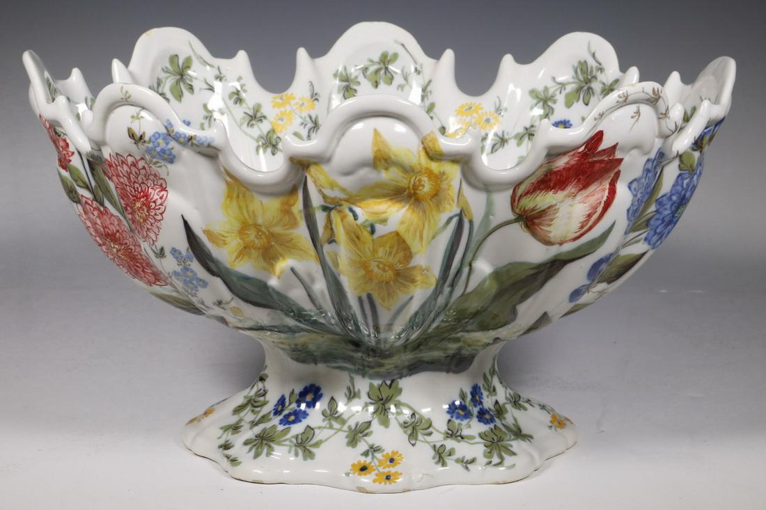 ITALIAN FAIENCE POTTERY FOOTED BOWL: Late 19th c. Le Nove di Bassano Tin Glazed Faience Oval Center Bowl, with the blue star mark, having a lobed top, scalloped sides and cinched foot, with overall hand painted polychrome spring floral d