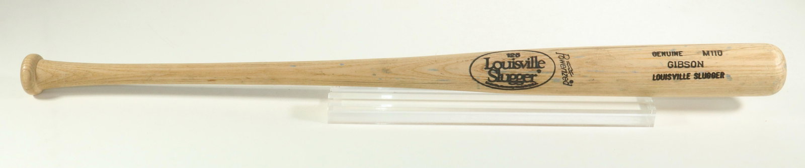 KIRK GIBSON LOUISVILLE SLUGGER BASEBALL BAT: Louisville Slugger M110 used by Kirk Gibson (1957 - ), Detroit Tigers outfielder, his #23 in marker on the handle butt. WS 1984 & 1988; NL MVP 1988. 34 3/4" long. Gray paint spatter.