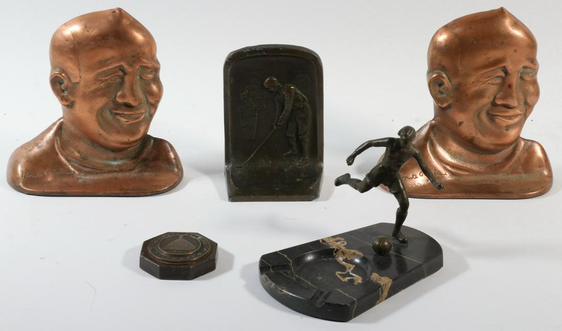 (5) BRONZE PCS, COLLEGIATE ATHLETICS: Including: A Pair of Bookends of Bust Portraits of Knute Rockne, with his 'autograph'; a Marble Ashtray with a bronze Soccer Player and ball; a Doorstop of a Golfer with Caddy and a Paperweight with t