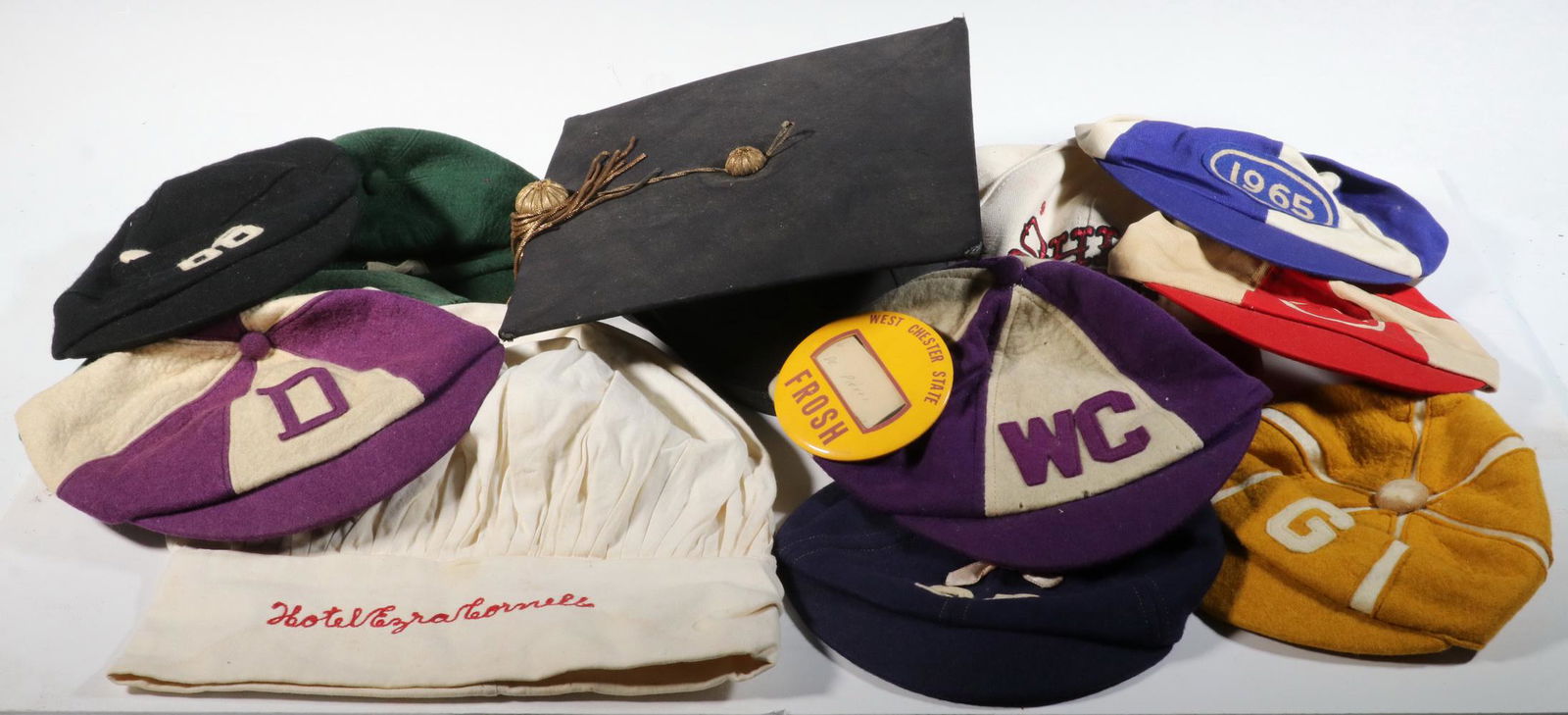 (9) VINTAGE COLLEGE BEANIES, BASEBALL CAP, CHEF'S TOQUE: Including: Beanies from Boston University, Dartmouth, Michigan, Georgia, others, Chef's Toque from Hotel Ezra Cornell, Baseball Cap from Ohio State, Mortarboard from Albany, NY.