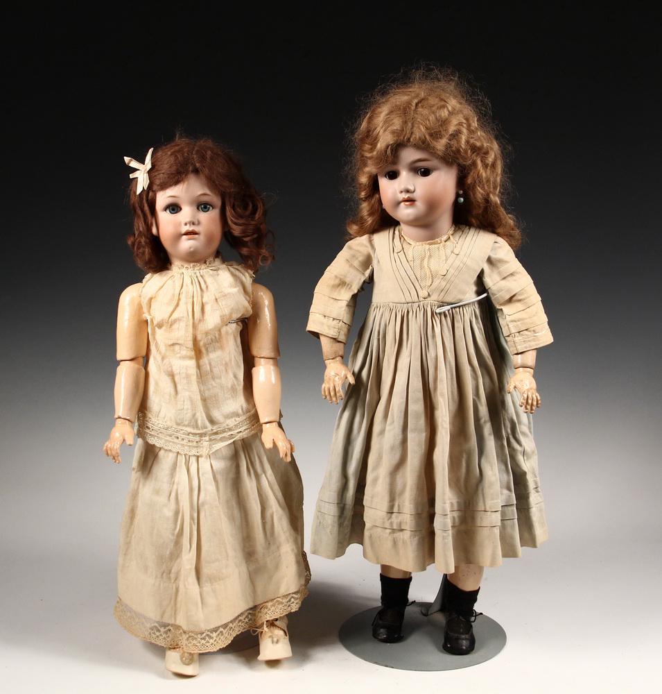 (2) ANTIQUE BISQUE HEAD DOLLS: Including: 24" Simon & Halbig (Heinrich Handwerck), with strawberry blonde hair, brown sleep eyes, open mouth with upper teeth, pierced ears, jointed composition body, plain pale green cotton dress, b