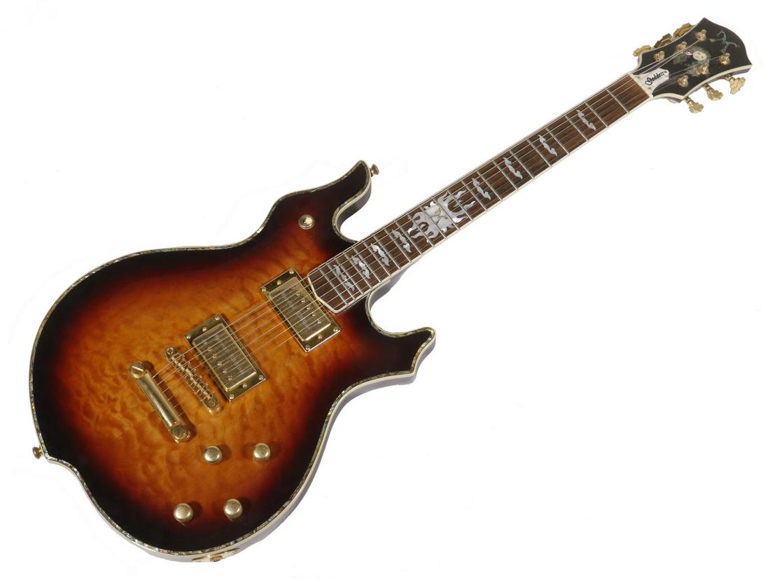 ELECTRIC GUITAR, MANARIK, GODDESS SPECIAL EDITION, S/N: Cherry burst quilted top, gold hardware, Jinho Tuners with Grover Imperial Style Buttons and Tone Perfect Resonata Pickups titled, engraved "Special Edition", rosewood fretboard with Jerry Garcia insp