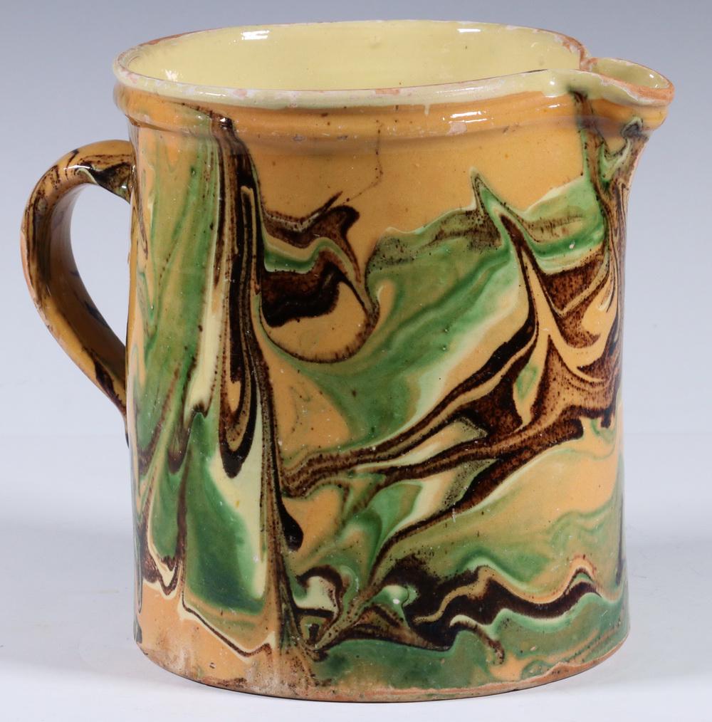 FRENCH JASPE POTTERY JUG: French 19th c. Jaspe Ware Terra Cotta Pottery Pitcher, with marbled swirl glaze, 7 1/8" high, 8 1/2" wide. Glaze frits and losses to rim, spout and handle.