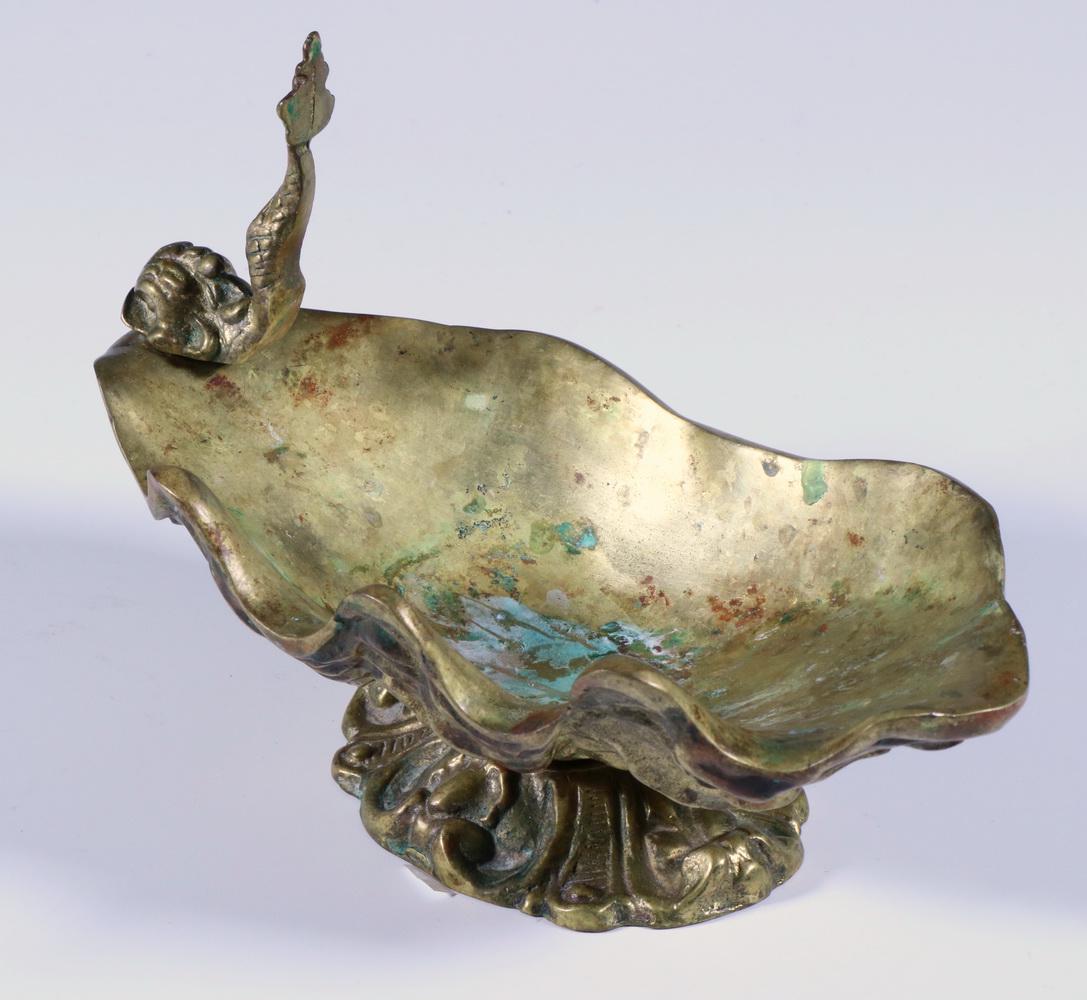 VIRGINIAL METALCRAFTERS BRONZE SHELL SOAP DISH: Heavy Bronze Tridacna Shell Form Soap Dish, by Virginia Metalcrafters, with molded dolphin, set on ornate footed base, foundry mark and '5405B' stamped on base, 5 1/4" high, 8" x 4 1/4". Good conditio