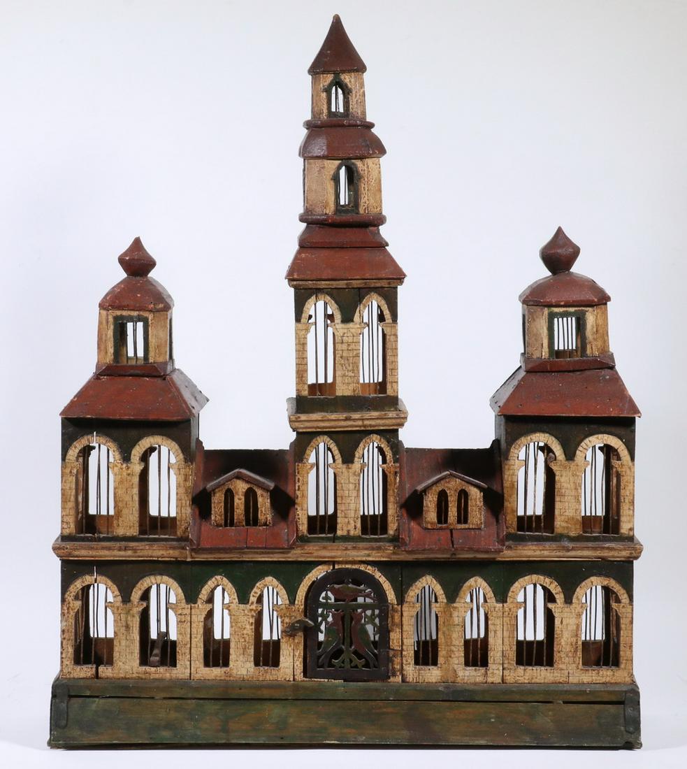 PAINTED WOODEN BIRDHOUSE: 19th c. Handcrafted Continental Birdhouse, in carved and painted wood, with metal bars, resembling a German municipal building, with front door hinged entry and lift top base edge for cleaning, with G