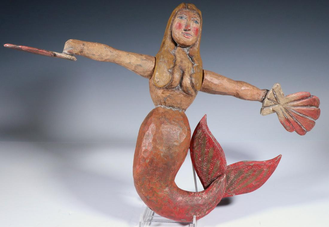 FOLK ART MERMAID WHIRLIGIG: Contemporary carved and painted wooden figure with rotating arms, 15" x 18". Good condition.