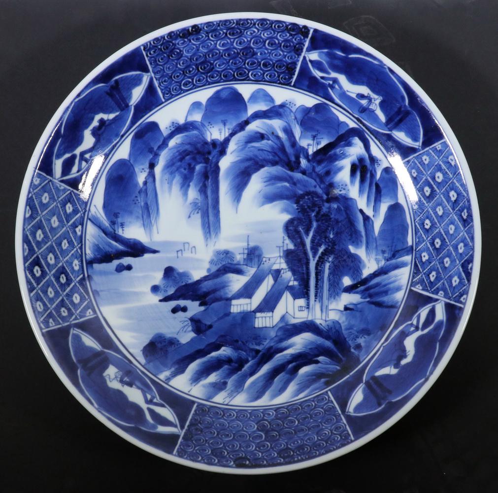 JAPANESE BLUE & WHITE BOWL: Large Japanese Blue and White Pottery Bowl, with seaside landscape decoration, paneled rim, red glazed rim underside, 3" high, 16 1/4" diam. Minor red glaze losses.