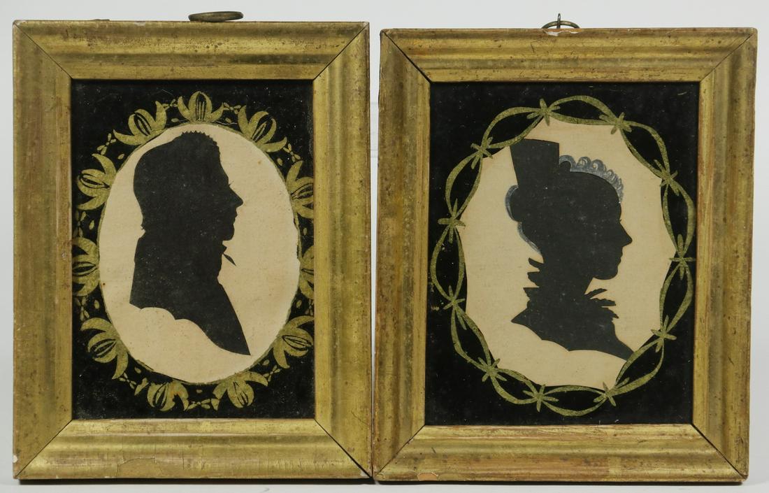 PR EARLY FRAMED SILHOUETTES: Pair of 19th c. Cut Paper Male and Female Silhouettes, in lemon gold frames with reverse painted glass mats, female image with painted hair embellishment, OS: 5 3/4" x 4 3/8". Frame paint losses.