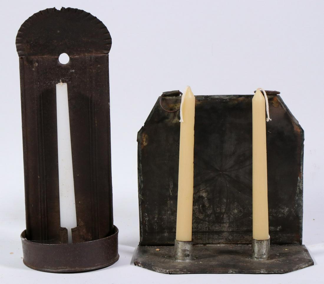 (2) EARLY 19TH C. TIN CANDLE SCONCES: Single Socket, with ruffled crown and demilune wax catcher, in remnants of black paint, 13" x 5" x 3 1/2"; PLUS Two-socket square with clipped corners, faint painting of a hex on the backplate, two ha
