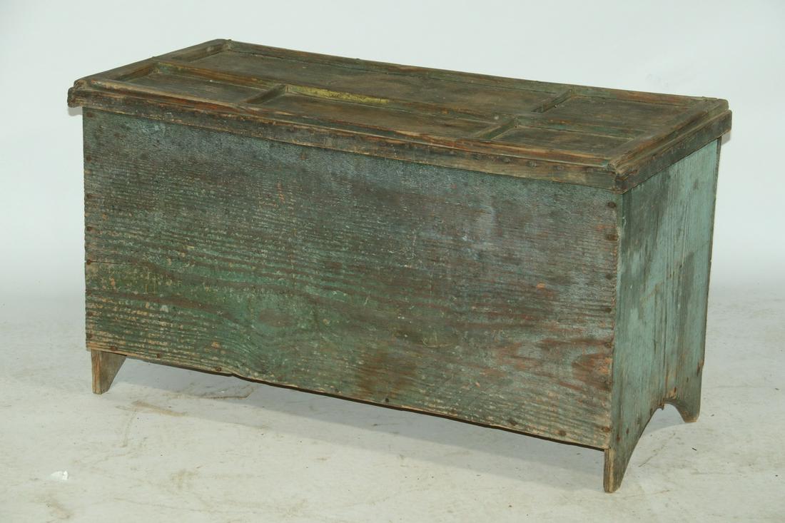 PAINTED PINE BLANKET BOX: 19th c. Country Blue Painted Pine Lift Top Blanket Box, nailed construction, paneled lid with side molding, exterior mounted iron hinges, cut out base sides, 23" high, 40" x 18 1/2". Dry and worn surf