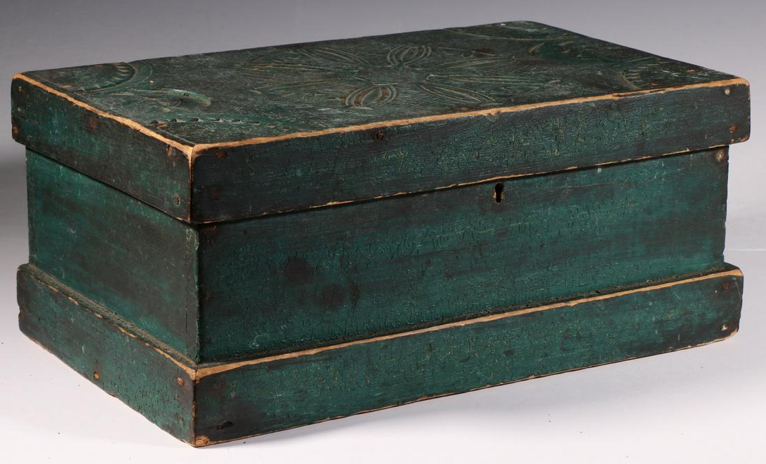 CARVED AND PAINTED STORAGE BOX: 19th c. Green Painted Pine Keepsake Box, with chip carved decoration to lid, hinged lid, 7 1/2" high, 17" x 10 1/8". Paint losses, corner wear.