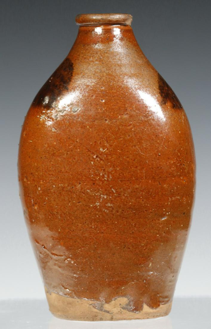 REDWARE FLASK: 19th c. Connecticut Glazed Redware Pottery Flask, flattened shape, with manganese shoulder decoration, 7" high, 4" x 2 3/4". Spout chip.