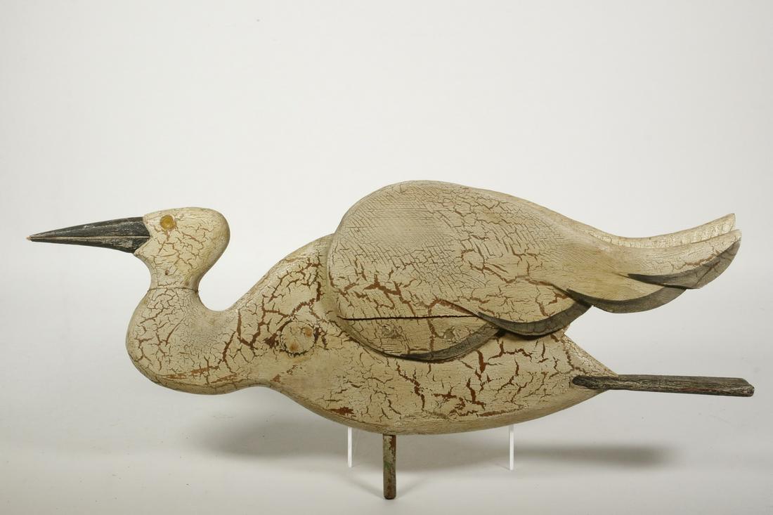 PAINTED CRANE FIGURE: Folk Art Painted Wooden Crane Figure, slightly extended attached wings, with metal tube for mounting on a base, 9 1/2" high, 21" wide x 3". One wing cracked, paint losses.