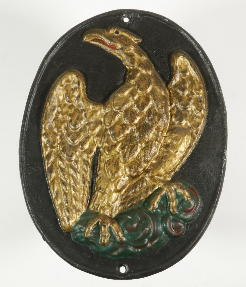 CAST IRON EAGLE FIRE MARK: Cast Iron Fire Mark with embossed Eagle, replica of an earlier Insurance Company of North America mark, 10 3/4" x 8". Small edge abrasion.