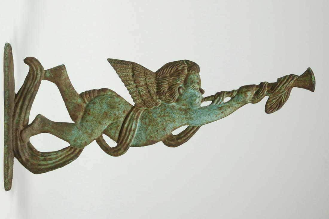 IRON "GABRIEL" SCULPTURE: Late 19th - Early 20th c. Iron Wall Mounted Sculpture Depicting the Angel Gabriel, playing his horn, with green paint, 6 1/2" x 13 5/8". Paint losses and surface rust.