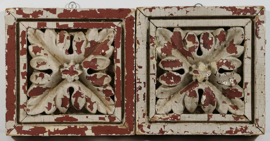 (2) CARVED AND PAINTED ROSETTE BLOCKS: Pair of Carved and Painted Decorative Architectural Blocks, rosette design, cracking off-white paint over red painted surface, with hanging hardware, 7 1/4" sq., 2 1/4" high. Paint losses, minor corne